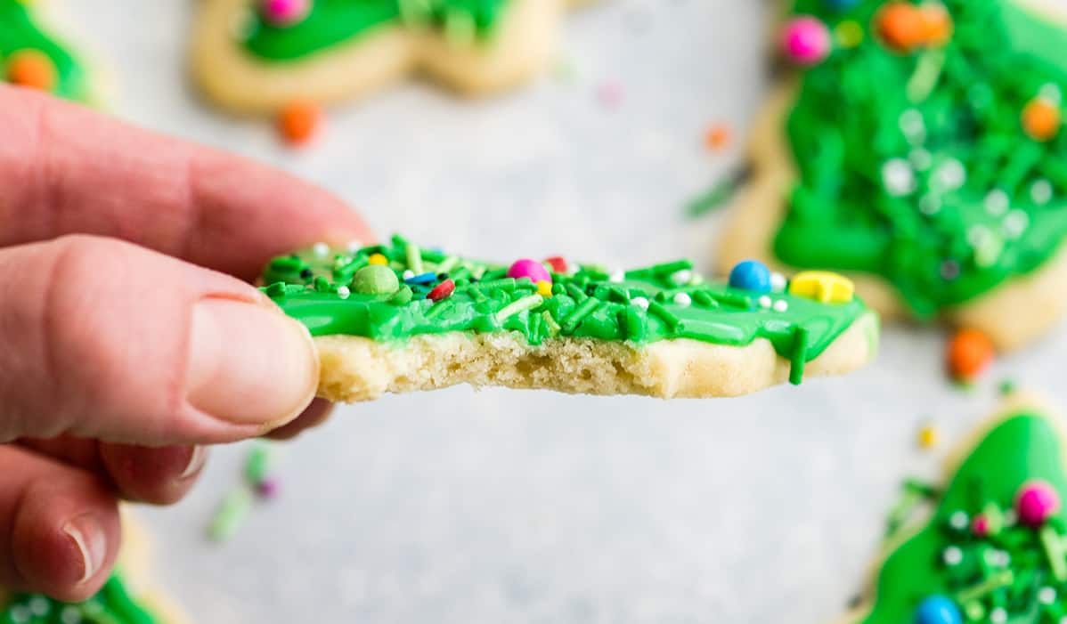 front view of a cut-outsugar cookie with a bite taken out of it