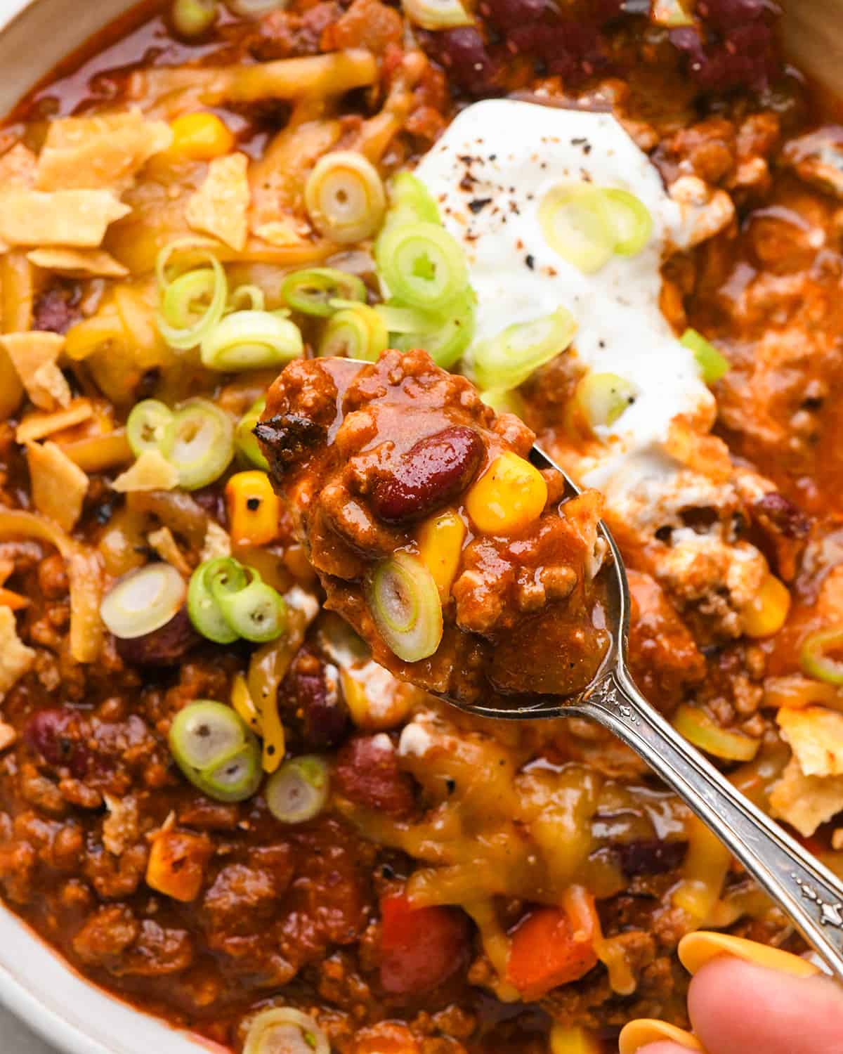 a spoon taking a scoop of easy chili from a bowl 