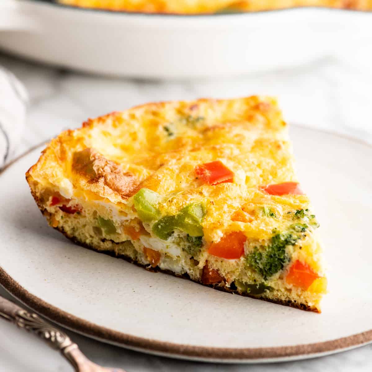 front view of a piece of frittata on a plate
