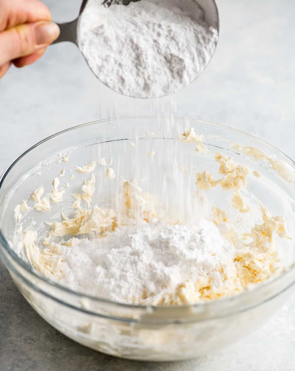 front photo showing how to make cream cheese frosting for cinnamon rolls