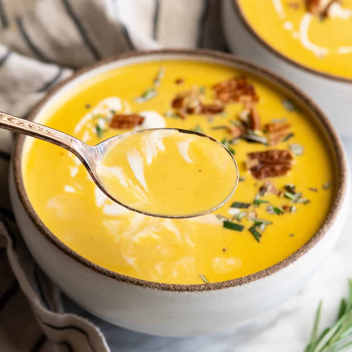 Up close photo of a spoonful of butternut squash soup