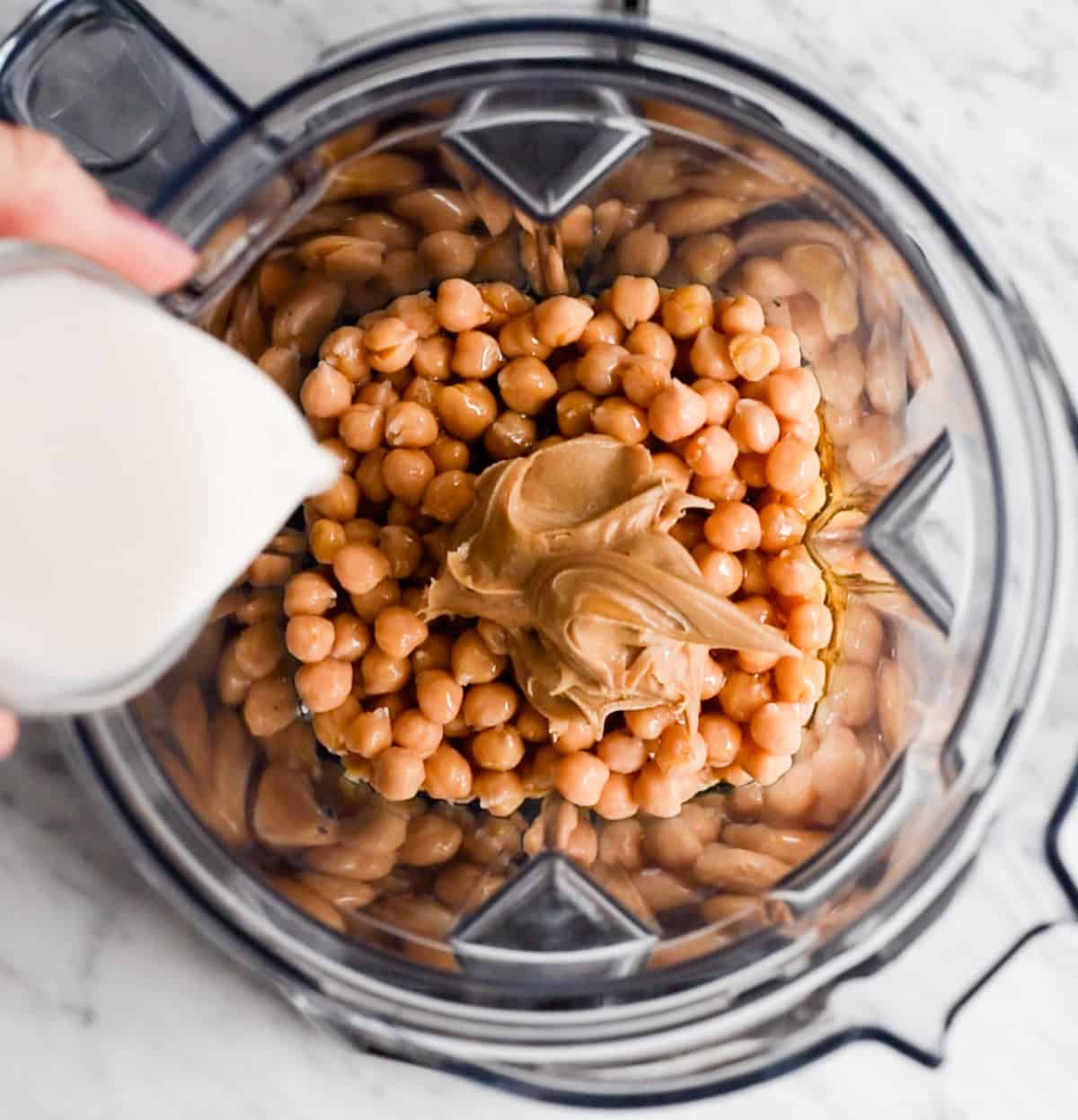 How to Make Chocolate Hummus - adding ingredients to the blending container before blending