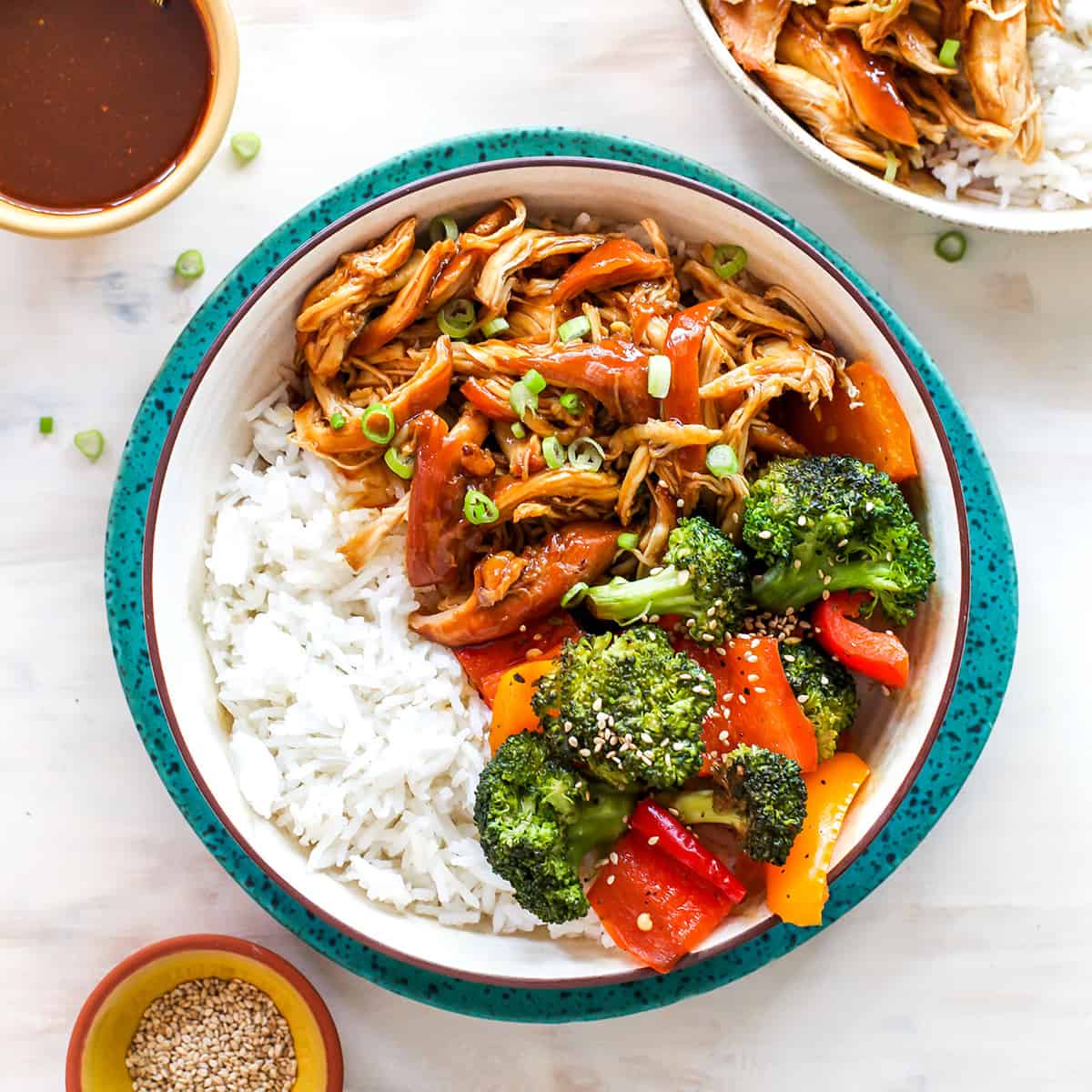 overhead view of a bowl of crockpot teriyaki chicken with veggies and rice