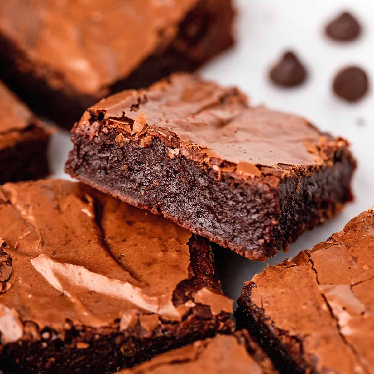 4 brownies, one resting on top of another so the inside is visible