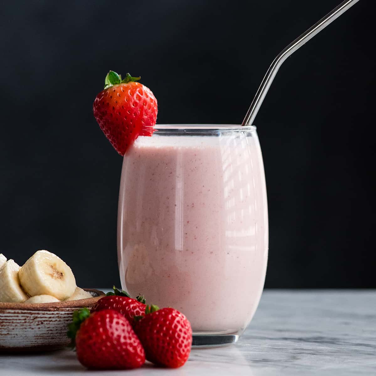 Front view of a glass full of a Strawberry Banana Smoothie