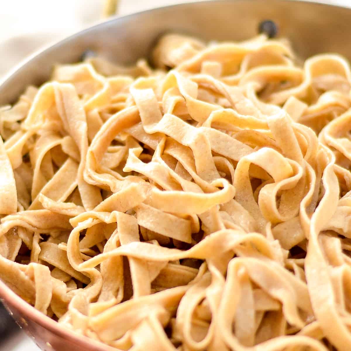 a colander filled with Homemade Whole Wheat Pasta noodles after cooking