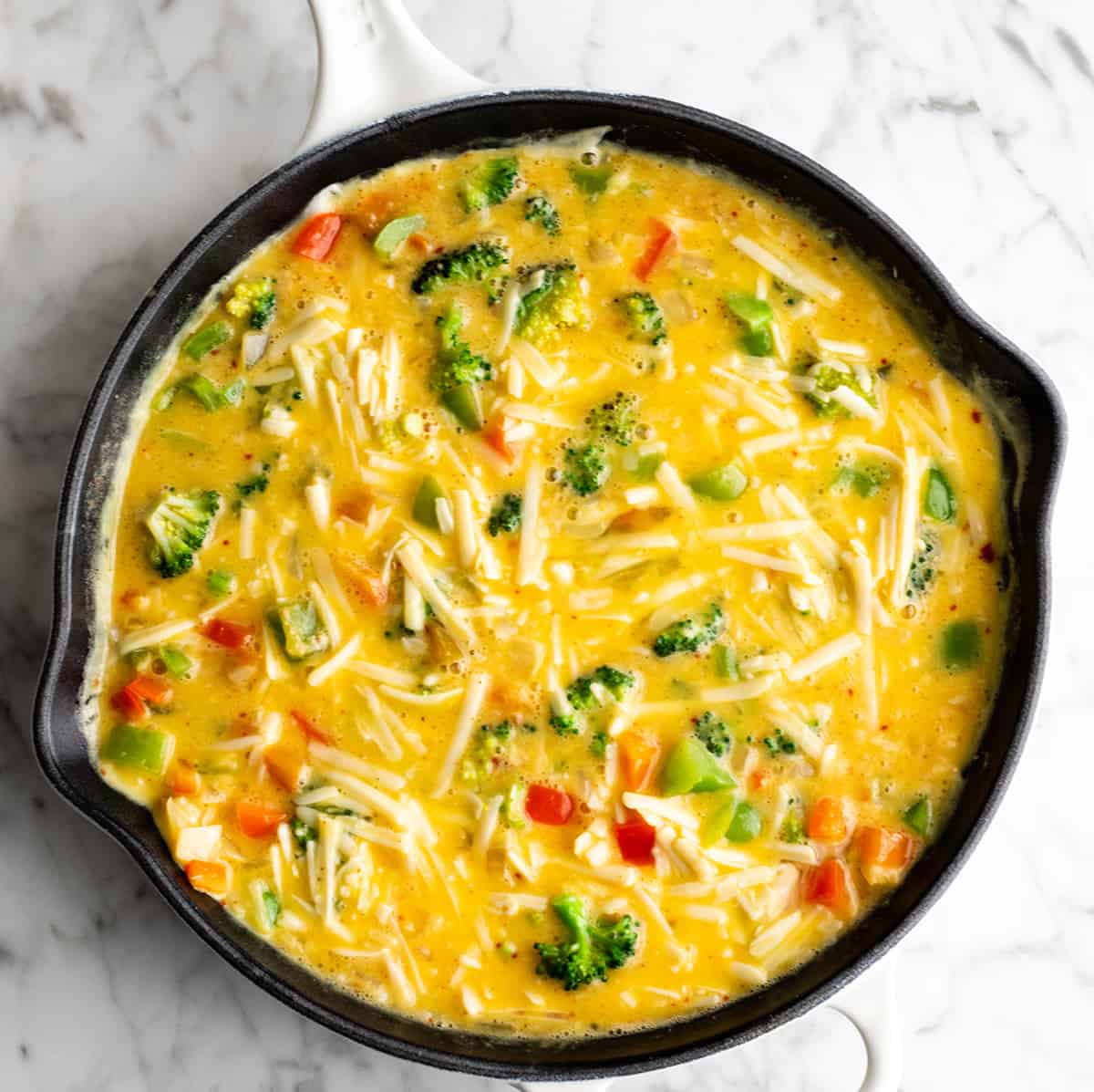 overhead view showing how to make a frittata edges just setting