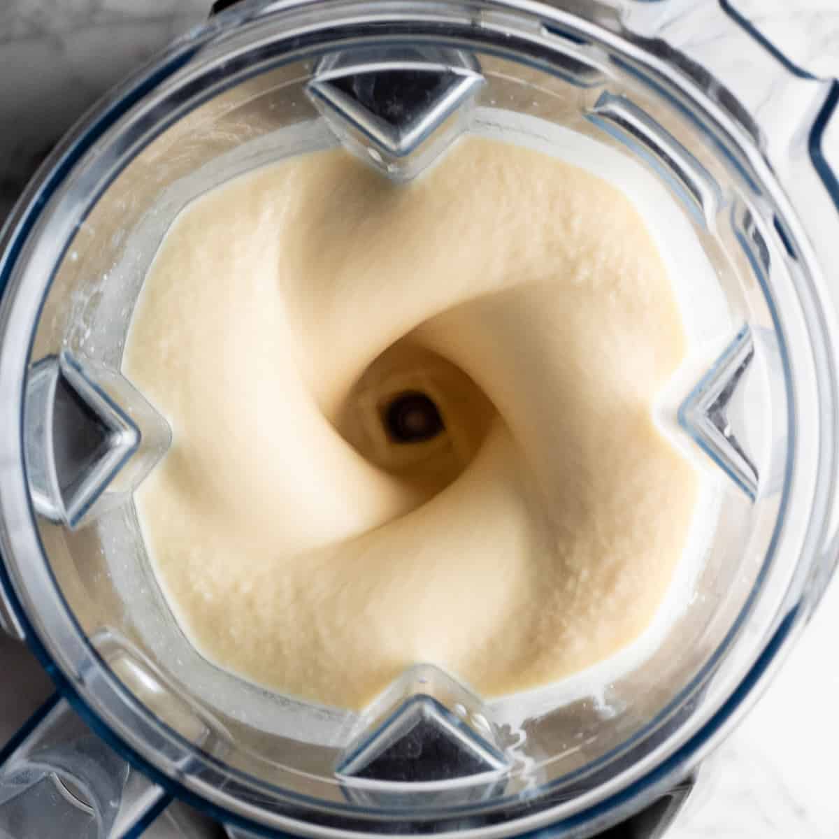 overhead view of this mango banana smoothie being blended