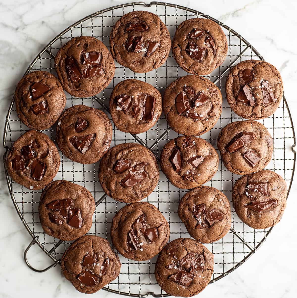 overhead view of 18 double chocolate cookies on a cooling rack