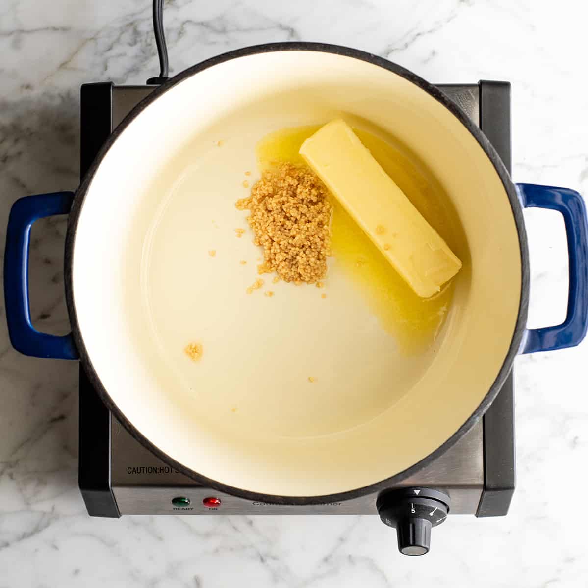 photo showing how to make mashed potatoes - cooking butter and garlic
