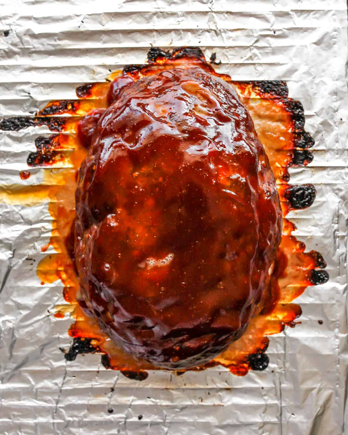 baked meatloaf on a baking rack after broiling to make the glaze thicken 
