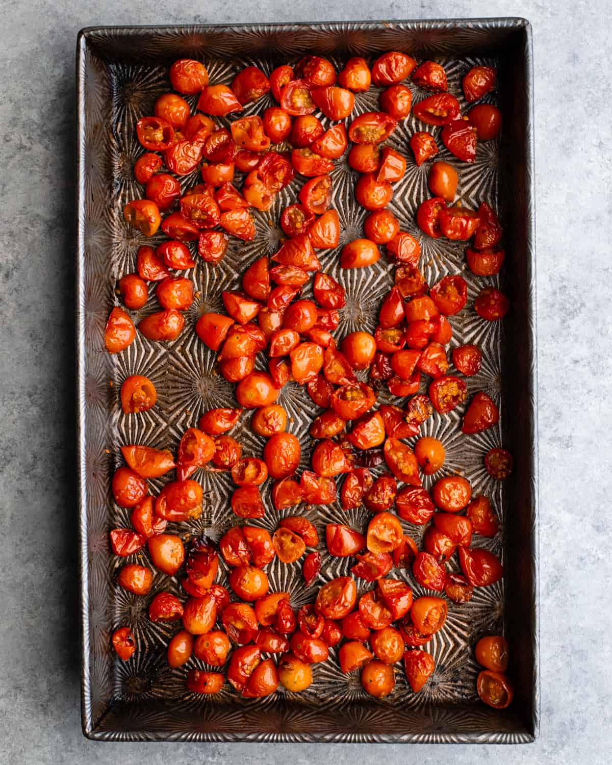 How to Make Pasta Salad - tomatoes on a baking sheet before roasting