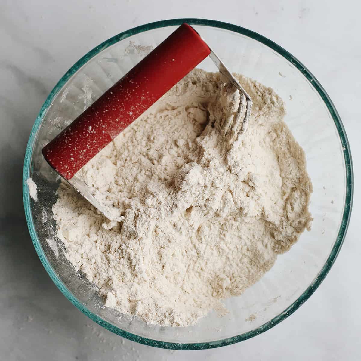 overhead photo showing How to Make Pie Crust with a pastry cutter