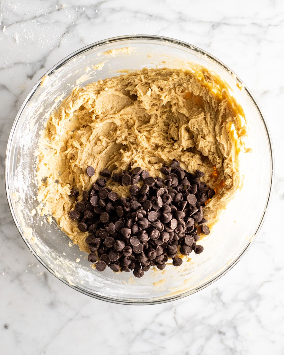 making a Chocolate Chip Skillet Cookie Recipe - adding chocolate chips